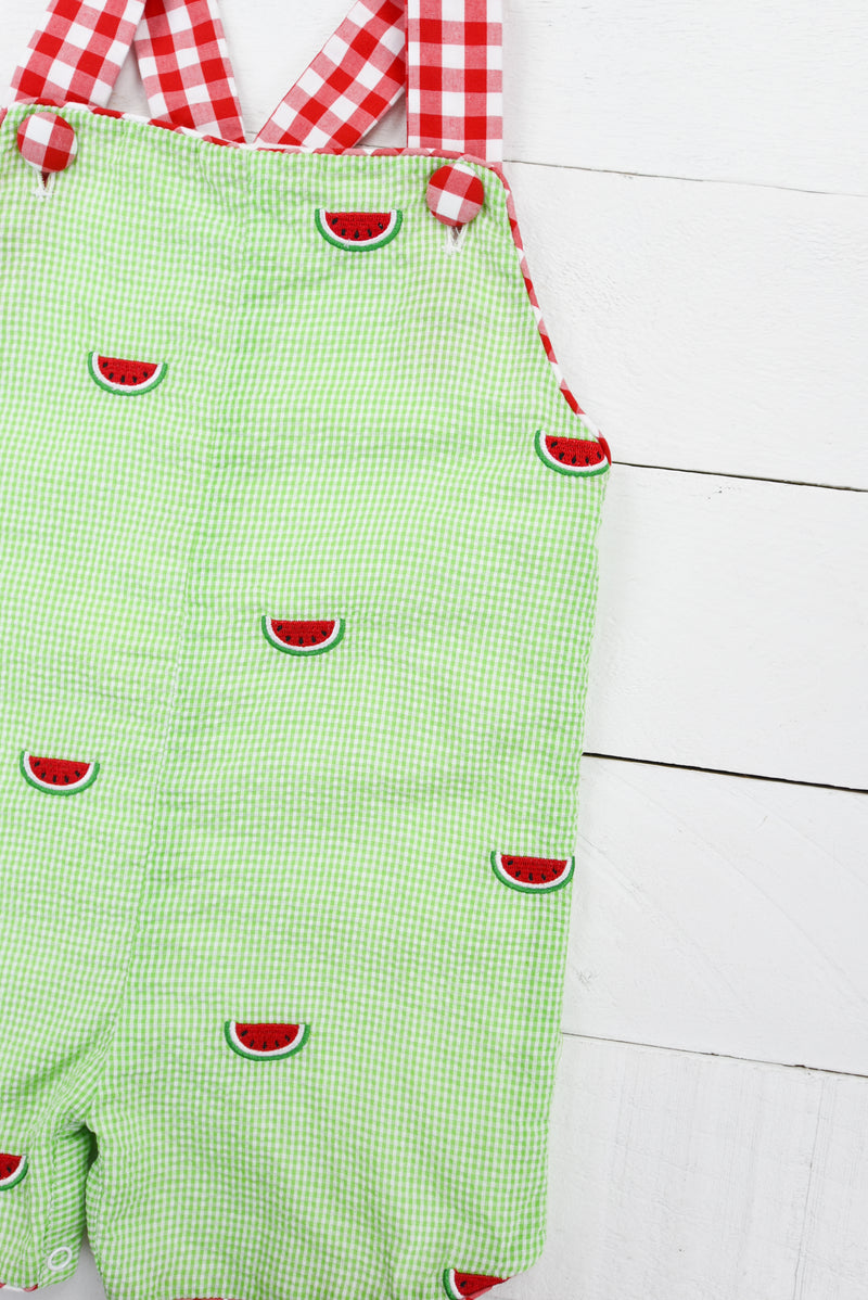 a pair of green shorts with watermelons on them